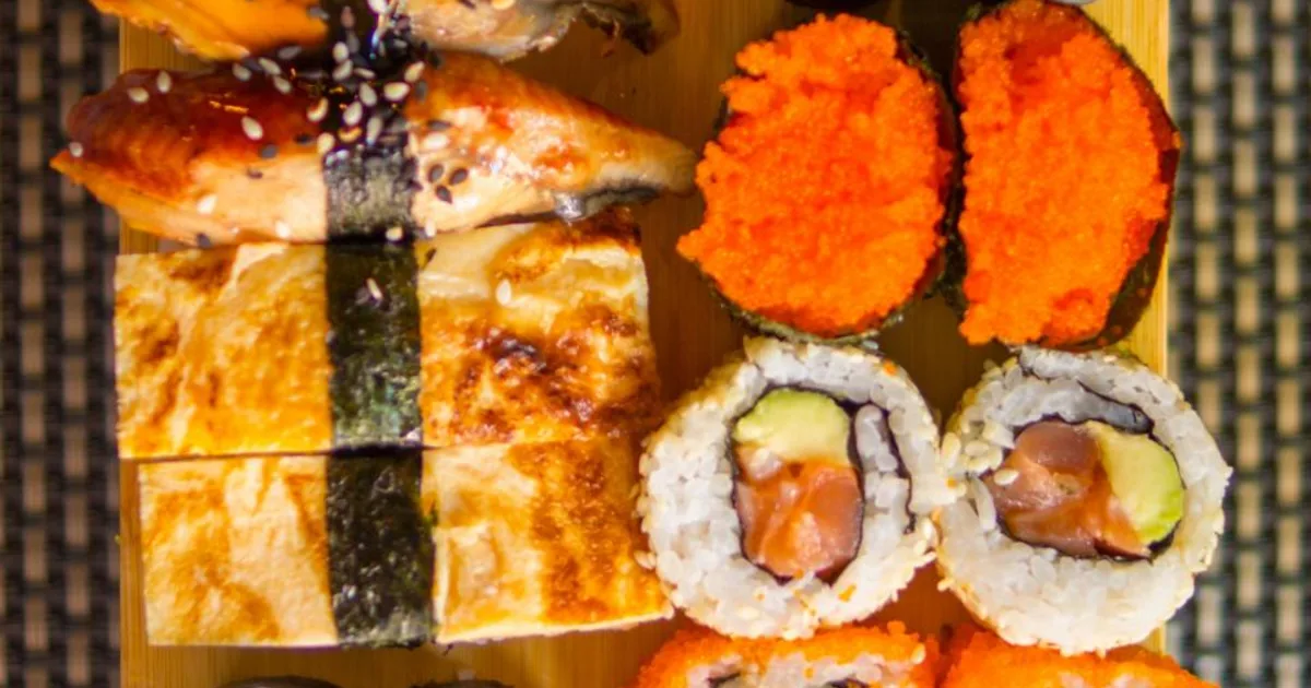 An assortment of nigiri and rolled sushi arranged on a plate